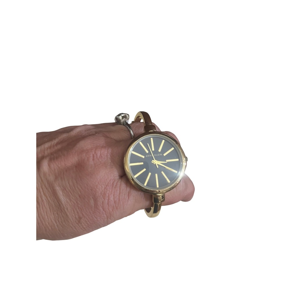 Anne‎ Klein Womens Bangle Watch Gold Tone Black Dial Round Case Minimalist